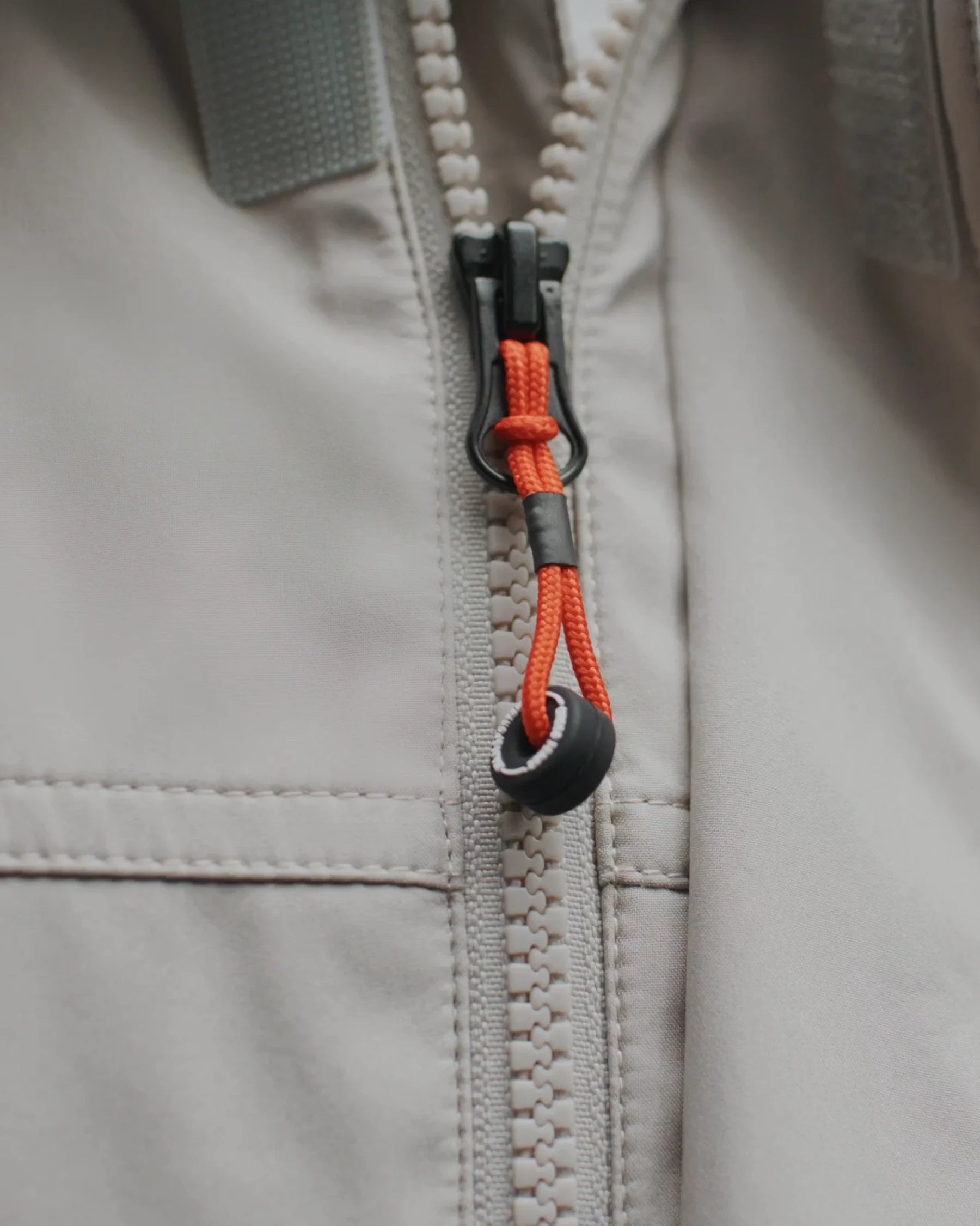 Zipper with orange cord pull