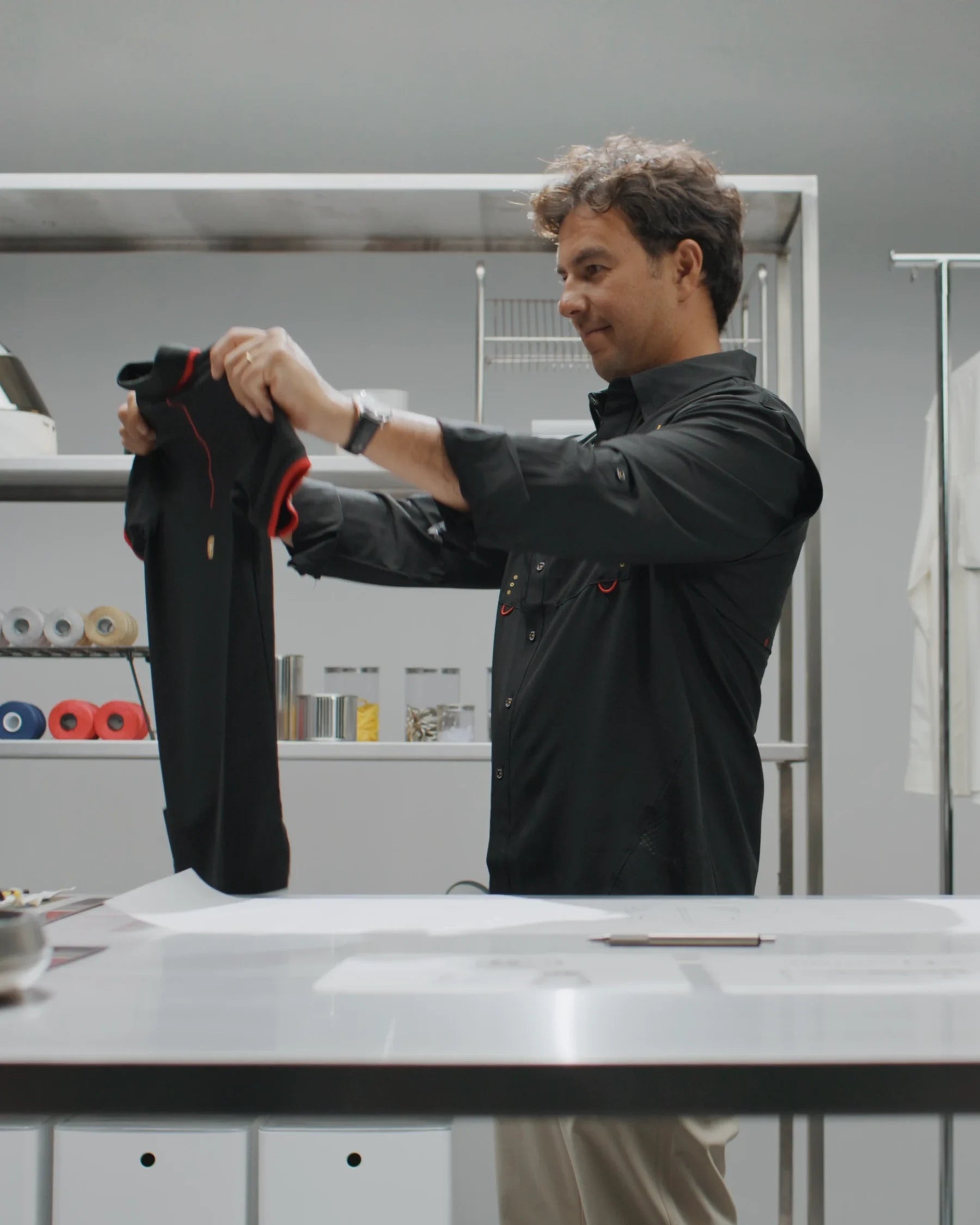 Checo reviewing a piece at the workshop